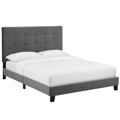 Gray velvet button-tufted queen platform bed with a tall tufted headboard, low frame and black legs