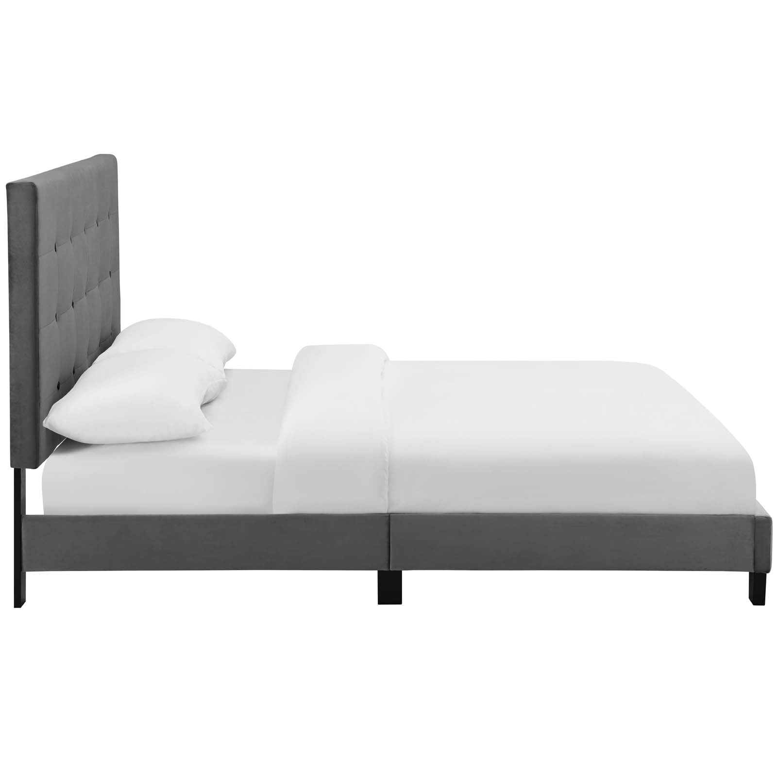 Gray upholstered platform bed with tall tufted headboard, white bedding and pillows, modern minimalist design.