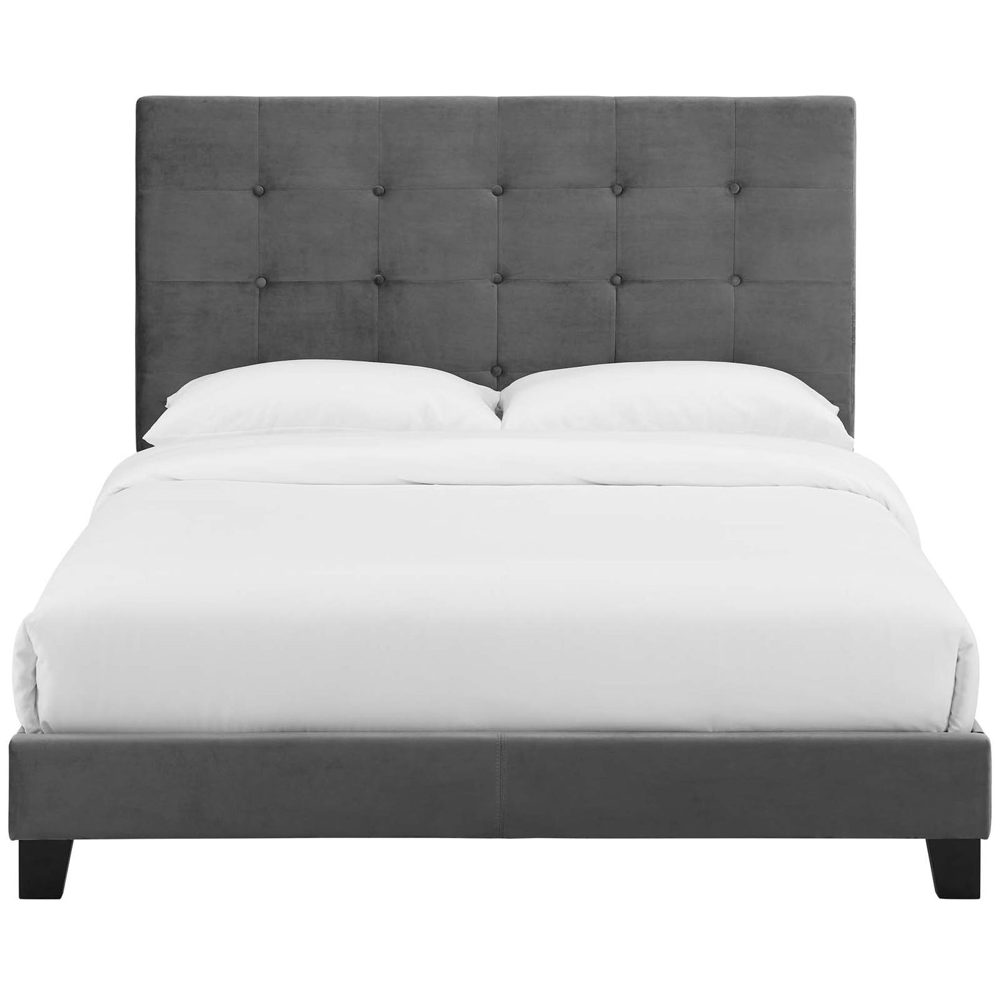 Grey fabric upholstered platform bed with a tall tufted headboard and white bedding.