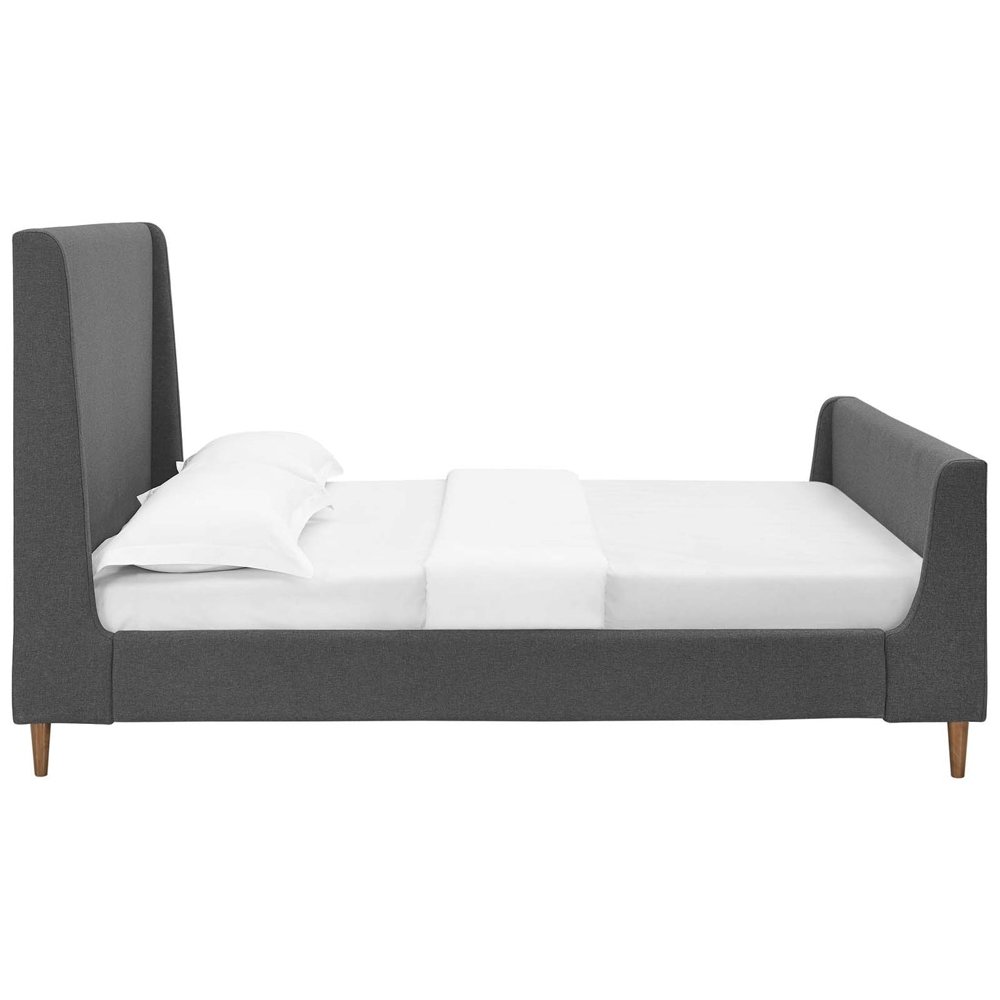 Grey upholstered fabric queen sleigh bed with white sheets and pillows