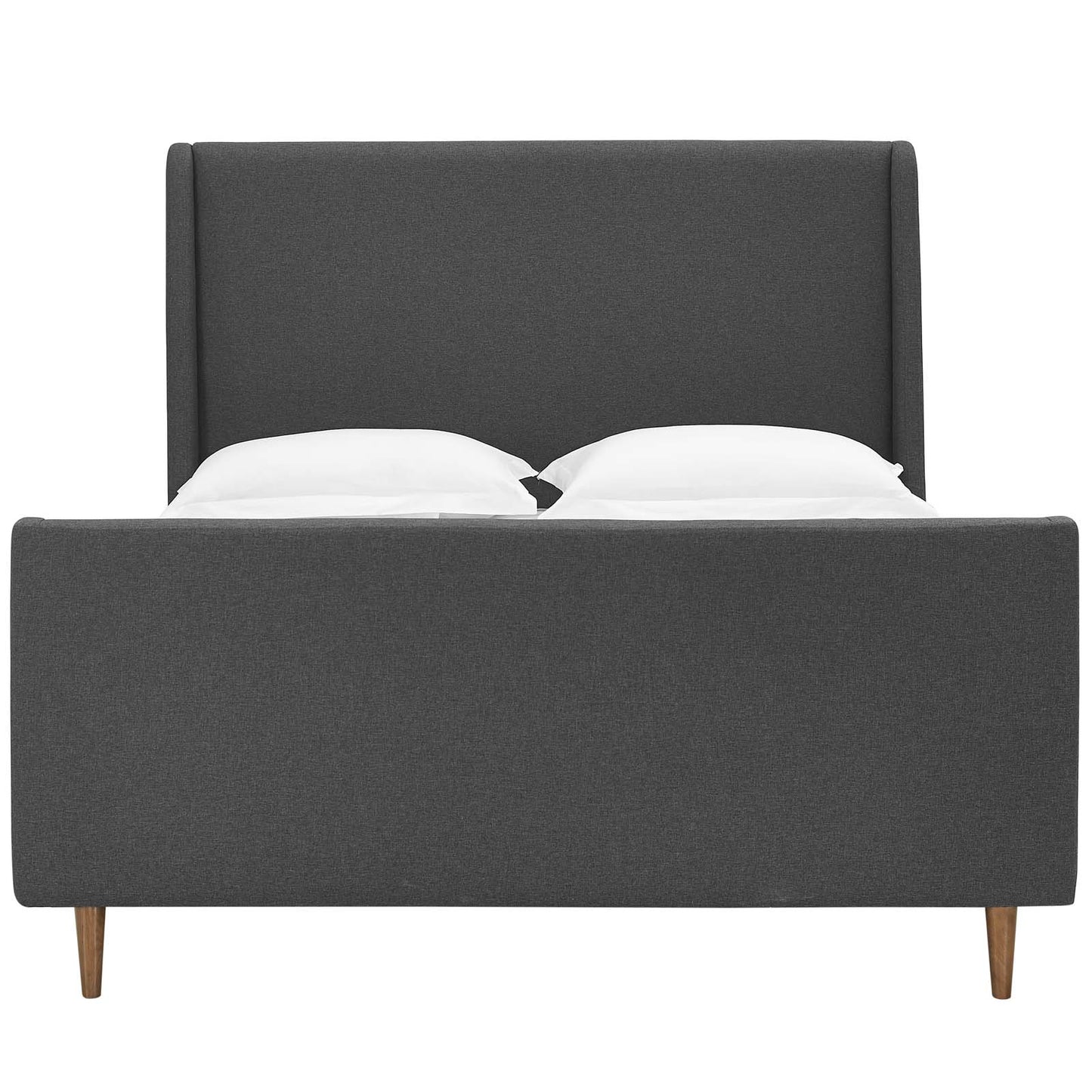 Grey fabric upholstered platform bed with tall headboard, low footboard, tapered wooden legs, and two white pillows.