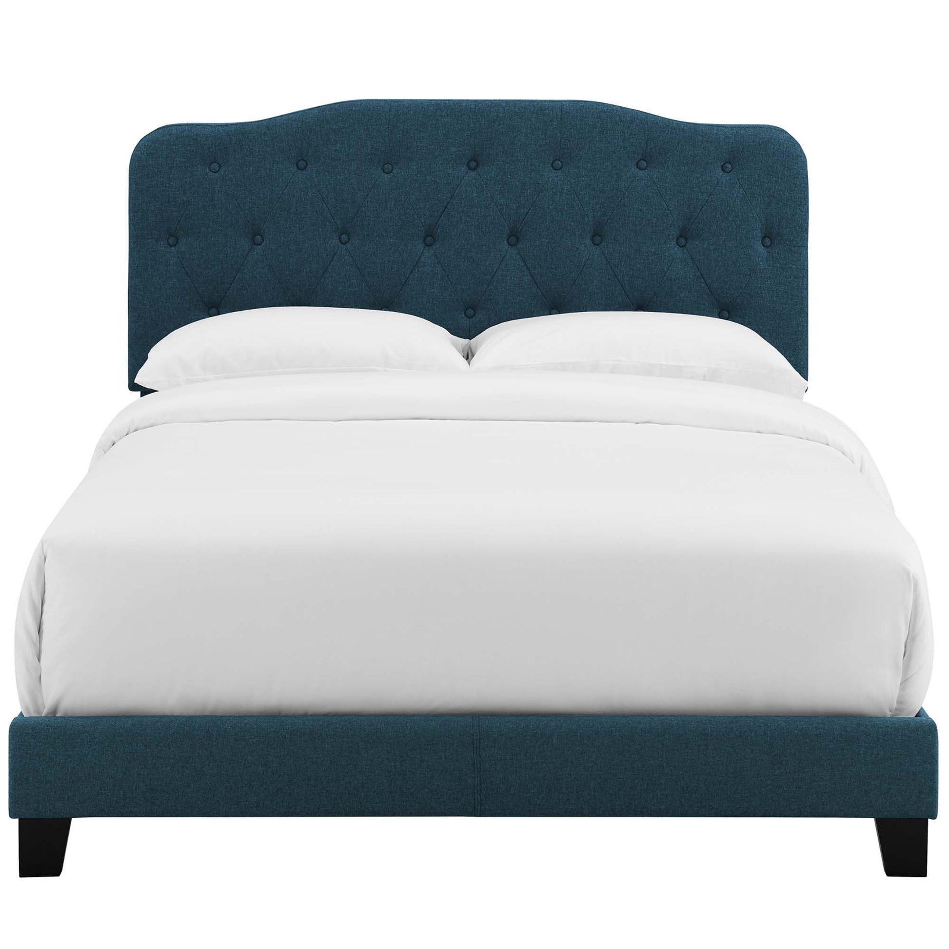 Azure upholstered queen bed with tufted arched headboard, white bedding, and dark wood legs.