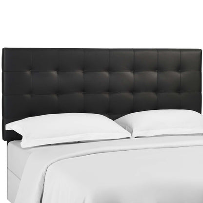 Black tufted faux-leather headboard with square stitching on a white platform bed.
