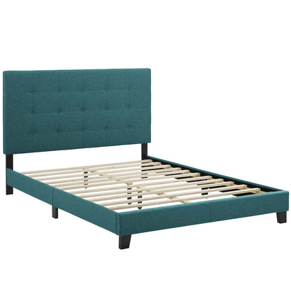 Teal upholstered platform bed with tufted headboard, low rails, black legs, and wooden slat foundation.