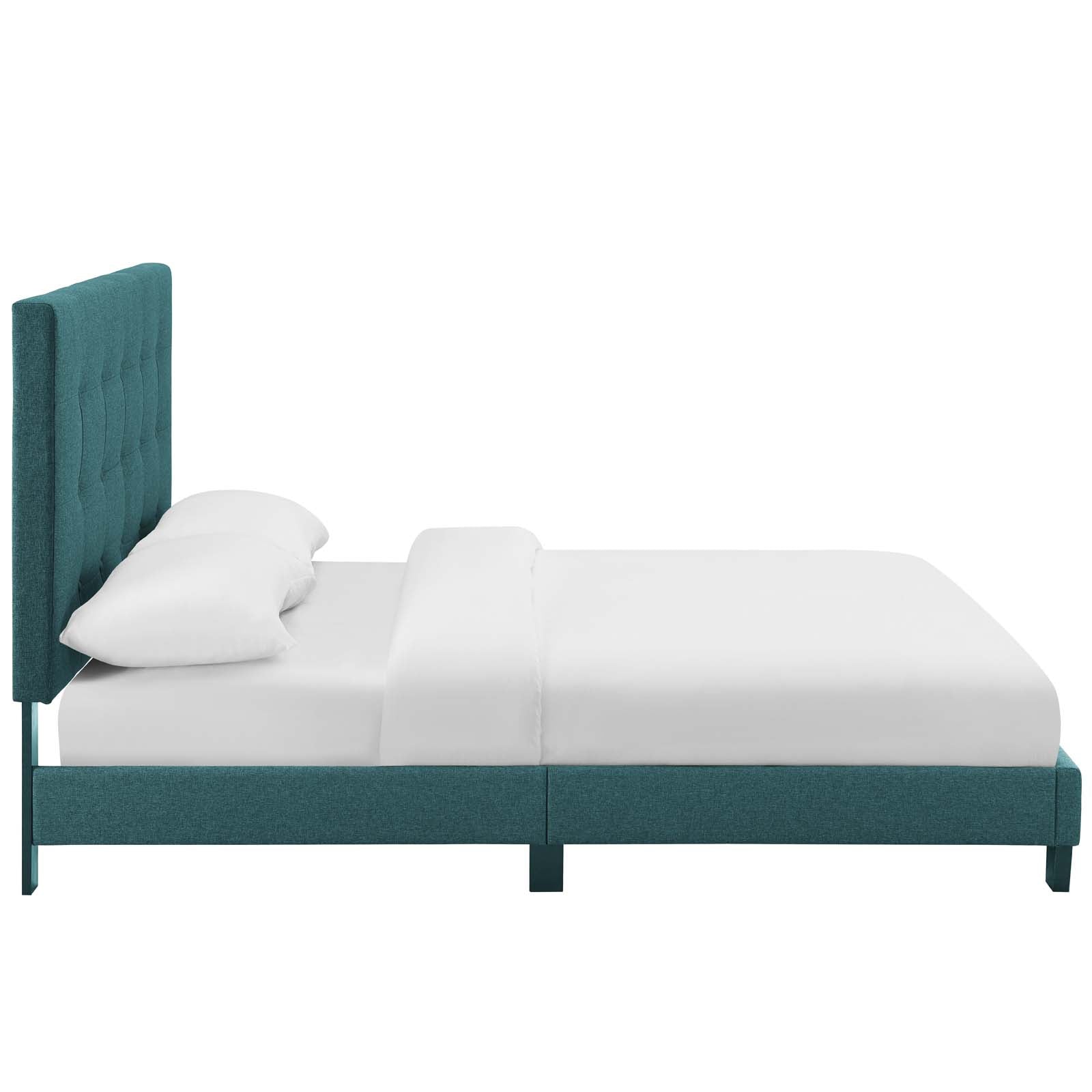 Teal fabric upholstered platform bed with tufted tall headboard and white bedding.