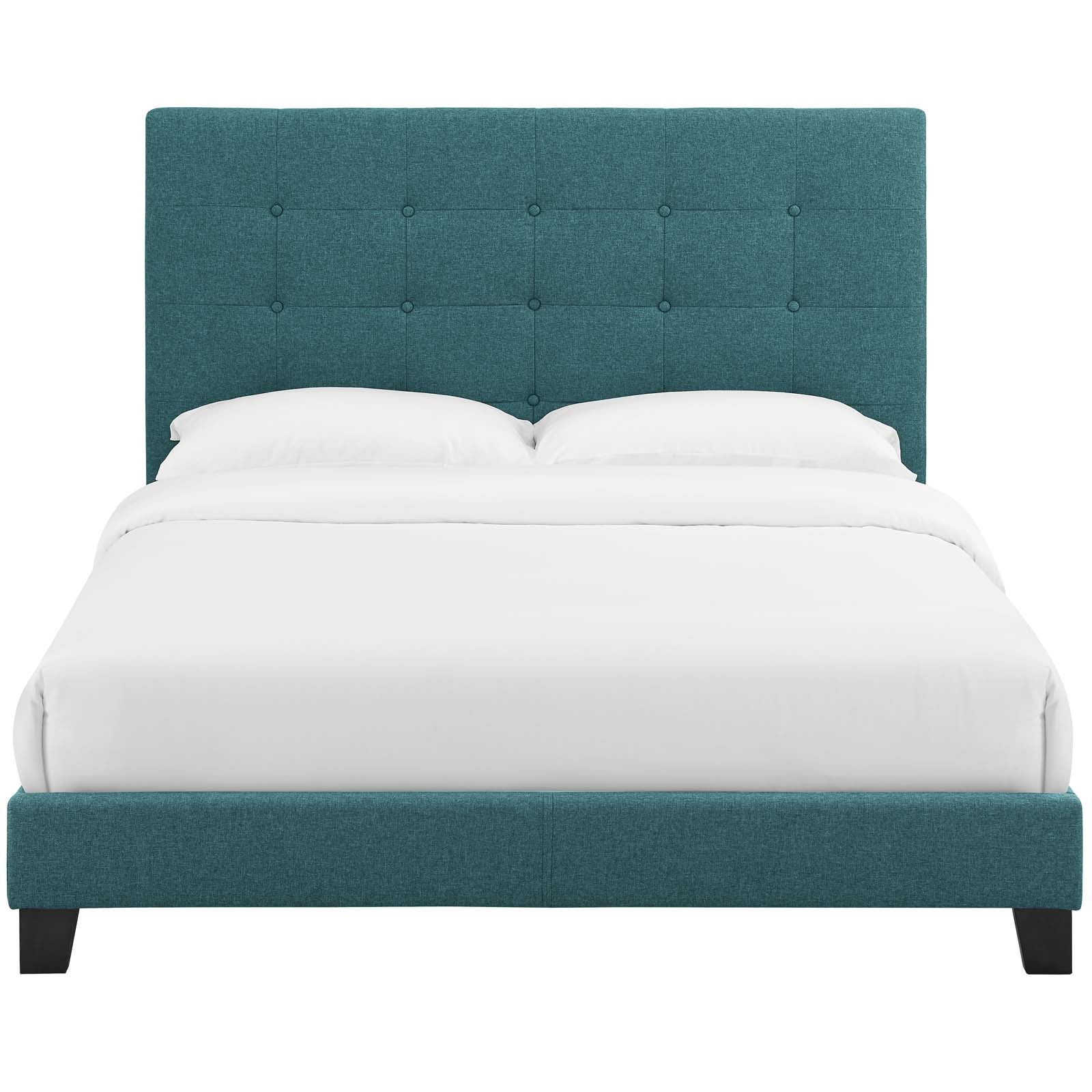Teal fabric upholstered bed with tall tufted headboard and low platform base on black feet, white bedding.