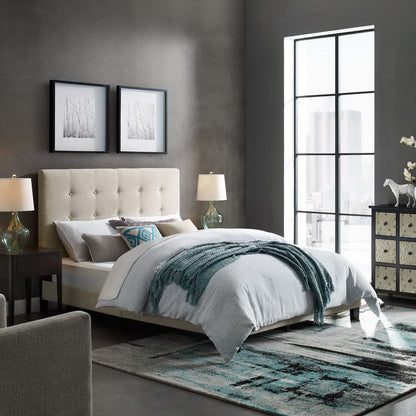 Beige tufted upholstered bed with gray bedding and teal throw, dark walls, two nightstands & glass lamps, large window