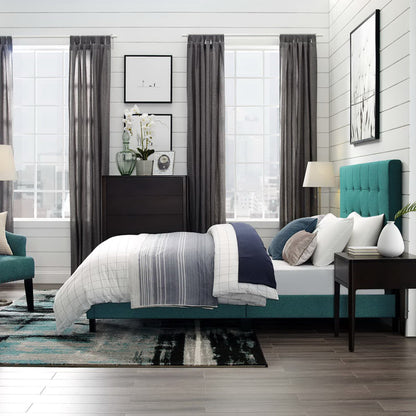 Teal upholstered platform bed with white-gray bedding, dark wood dresser, and gray curtains in a modern bedroom.