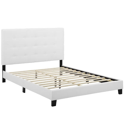 White upholstered headboard with tufted button pattern, white frame, black legs, slatted bed base.