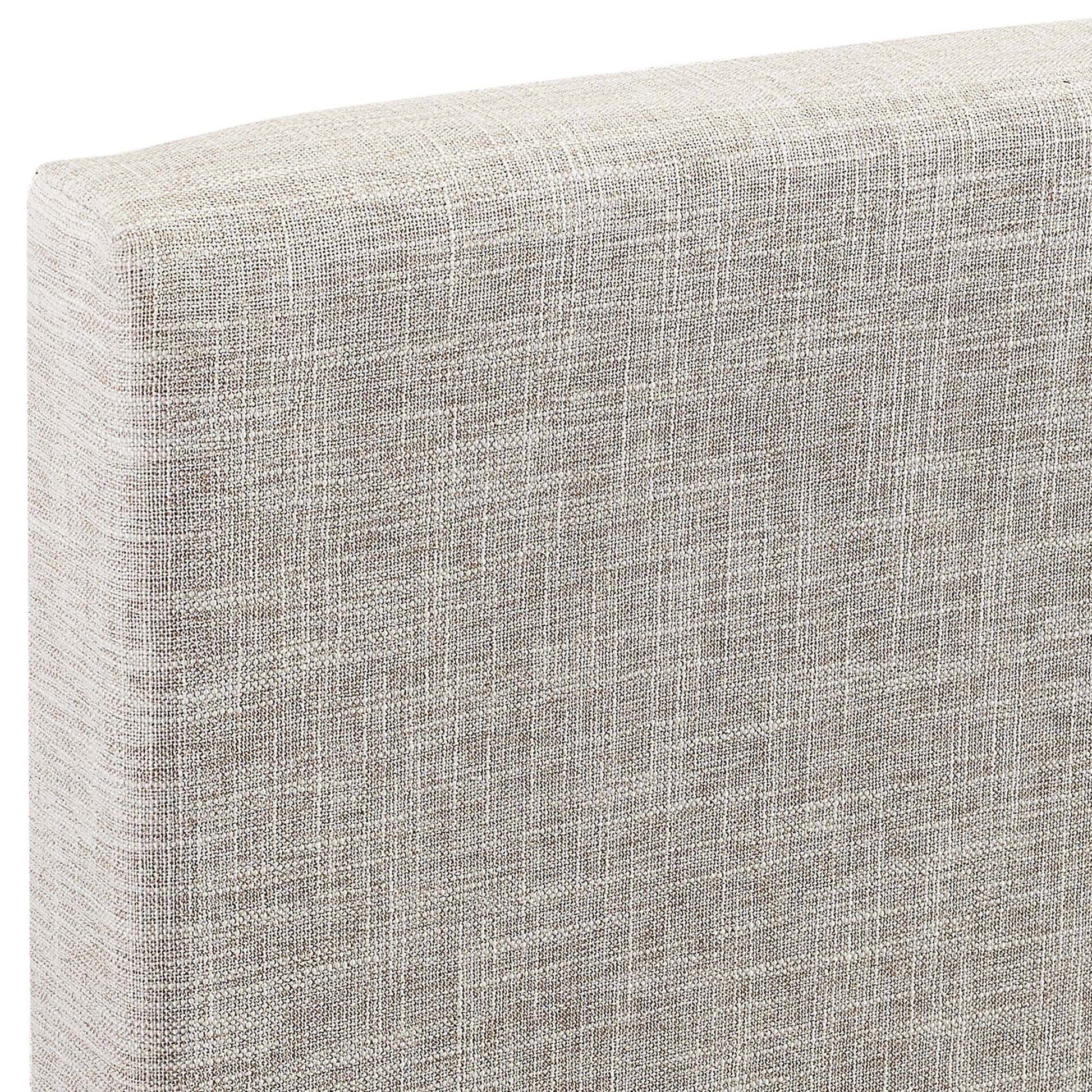 Beige textured linen-look fabric on a curved upholstered headboard, neutral modern style.