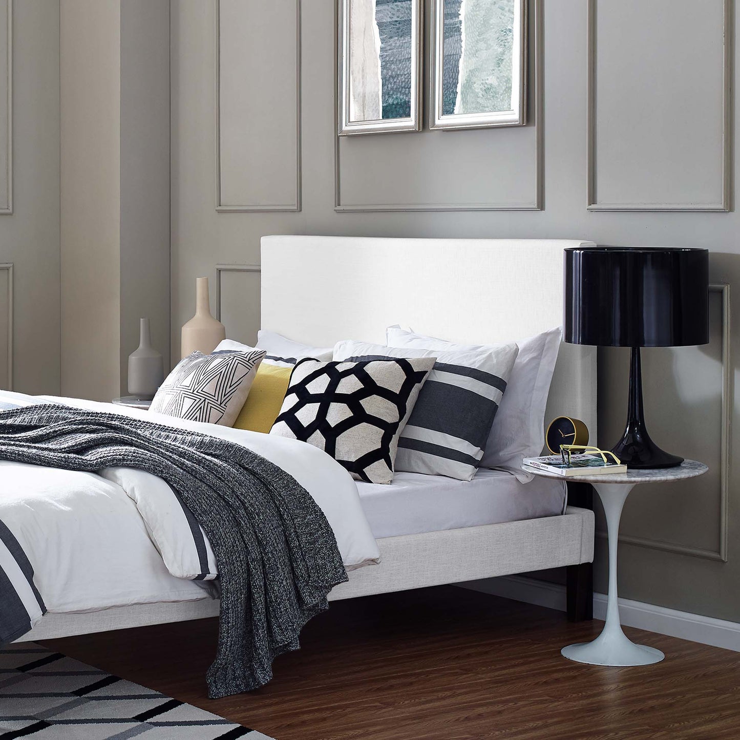 White upholstered linen fabric headboard with a simple rectangular panel design mounted on a wall