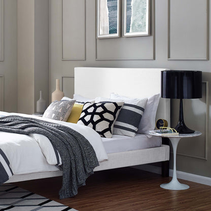 White upholstered linen fabric headboard with a simple rectangular panel design mounted on a wall