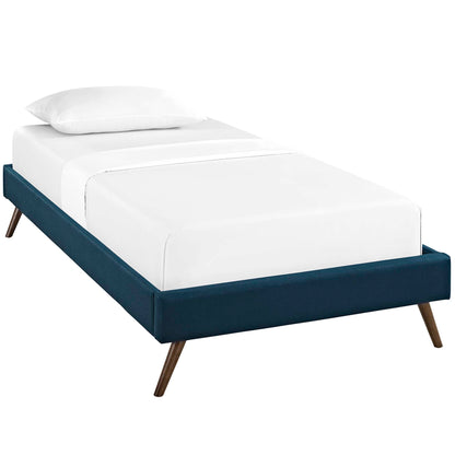 Low-profile azure fabric upholstered twin bed frame with round splayed legs and white bedding.