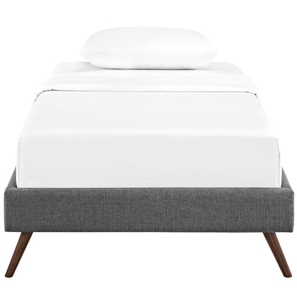 Gray fabric upholstered twin bed frame with round splayed legs, white mattress and pillow