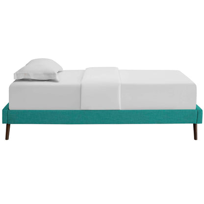 Teal upholstered twin bed frame with round splayed legs, low-profile, white modular cushions and a white pillow.