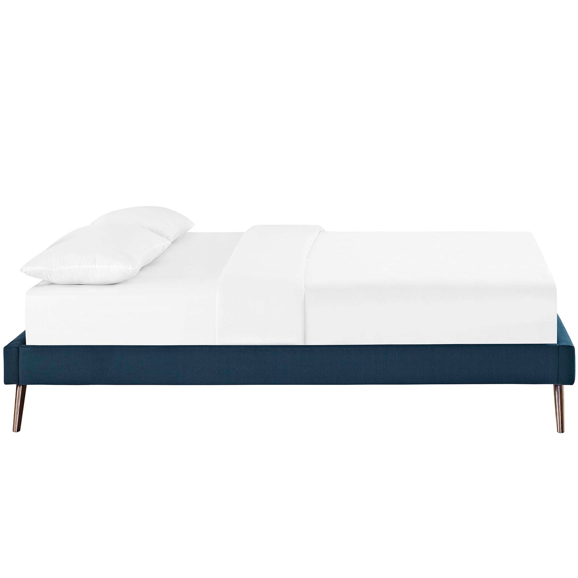 Navy blue fabric full bed frame with round splayed legs, white mattress and pillows.