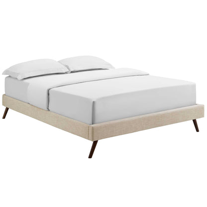 Beige upholstered full bed frame with round splayed legs & white bedding with two pillows.