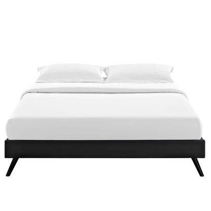 Black low-profile bed frame with round splayed legs and white bedding, modern minimalist bedroom furniture.