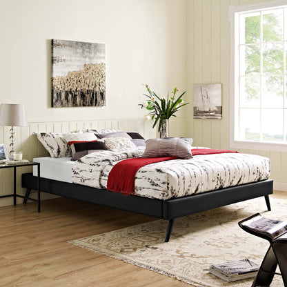 Black vinyl queen bed frame with round splayed legs in a sunny modern bedroom, with marble-gray and white bedding, a red throw, and a beige rug.