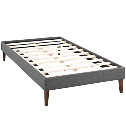 Grey fabric upholstered platform bed frame with a slatted wooden base and tapered legs.
