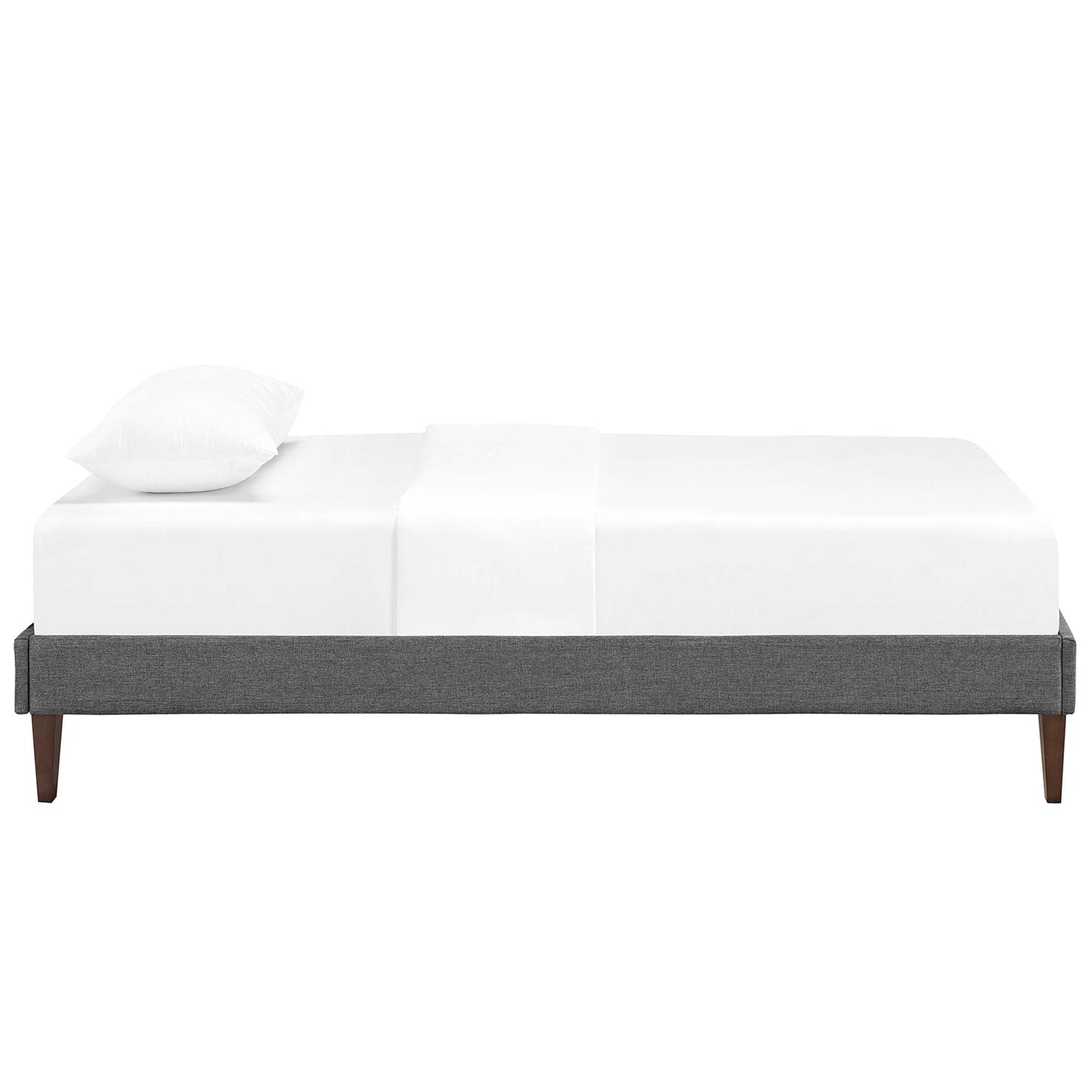 Gray upholstered platform bed frame with tapered wooden legs and white bedding.