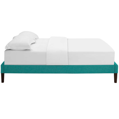 Teal upholstered king bed frame with squared tapered legs, white bedding and two pillows.