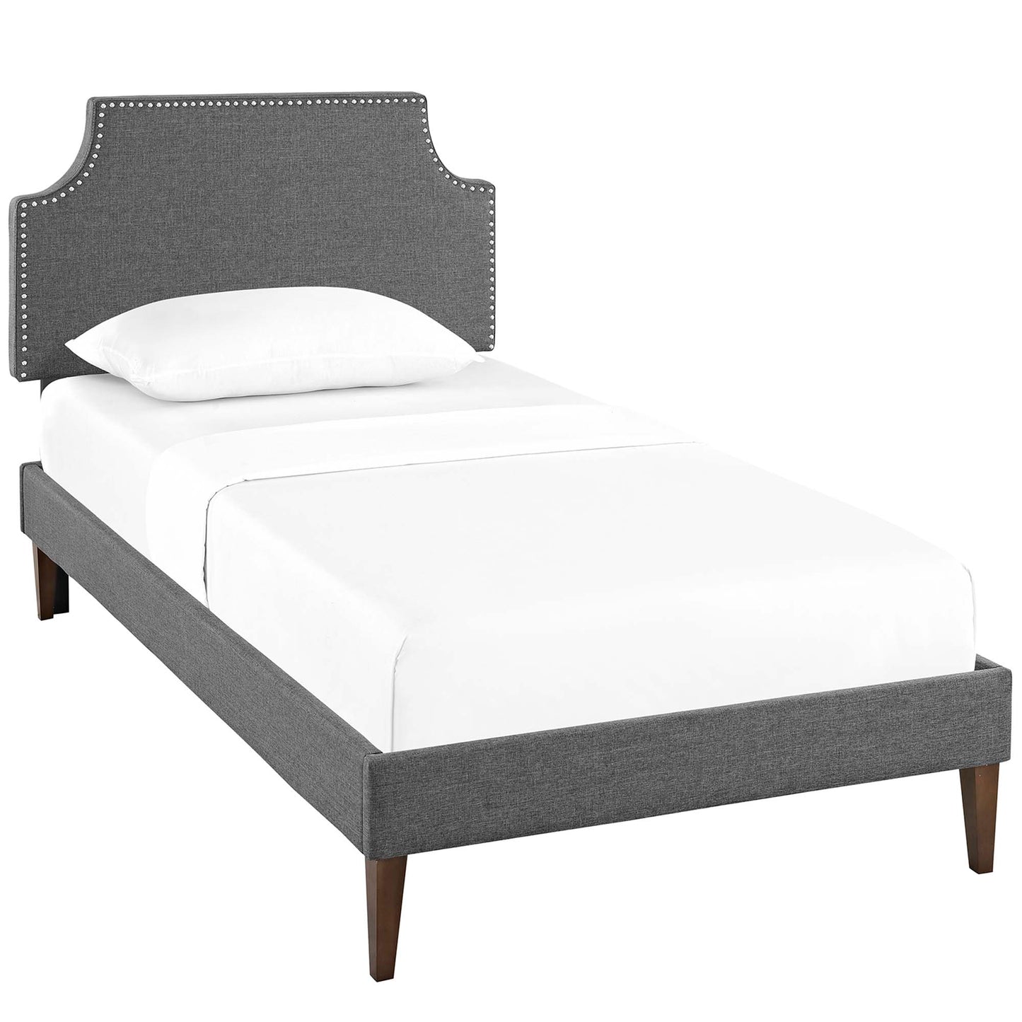 Gray upholstered twin platform bed with squared tapered legs, fabric frame, and white bedding.