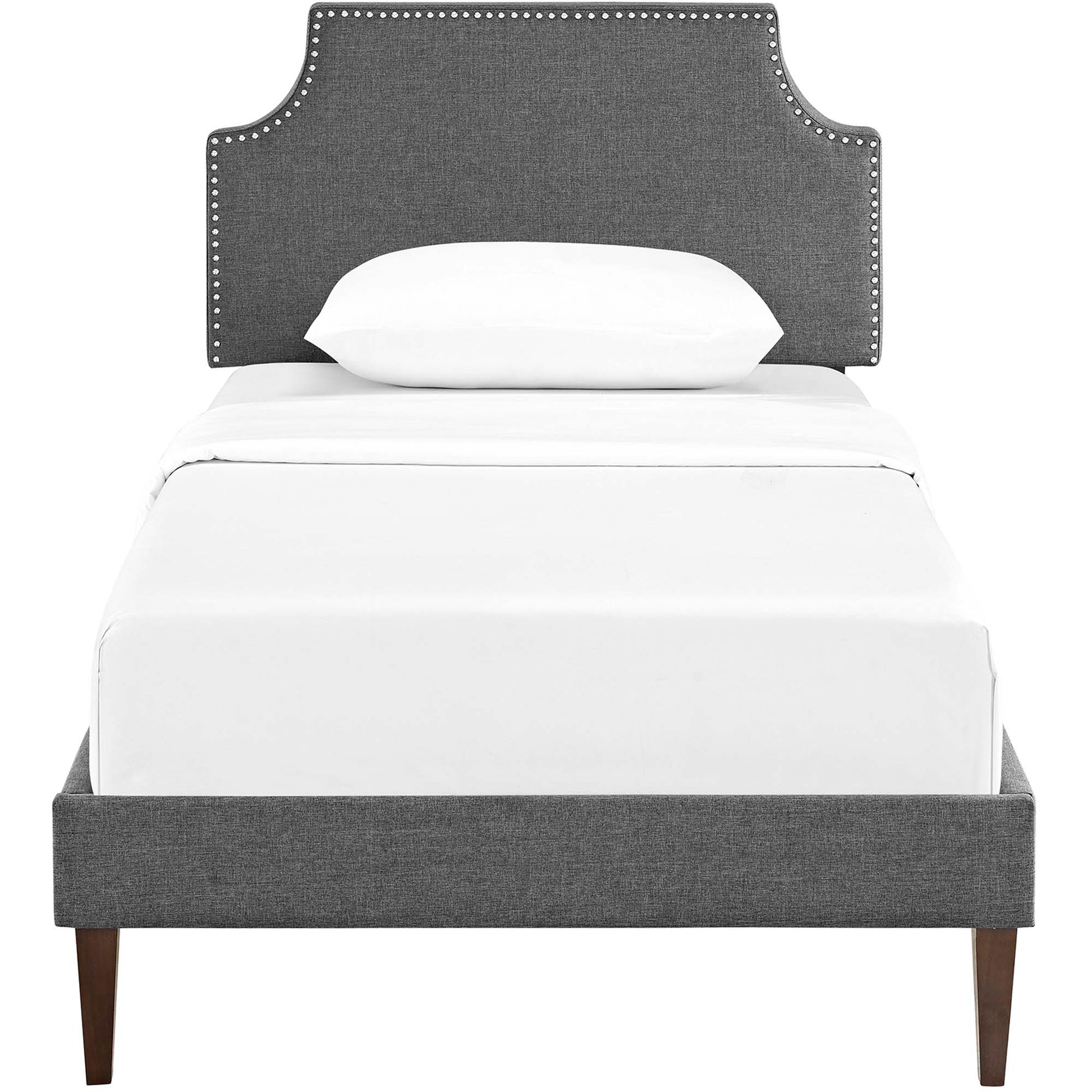 Gray fabric platform bed with squared tapered legs and white bedding.