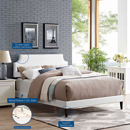 White vinyl upholstered platform bed with nailhead trim, LVL slats, squared tapered legs; no box spring required.