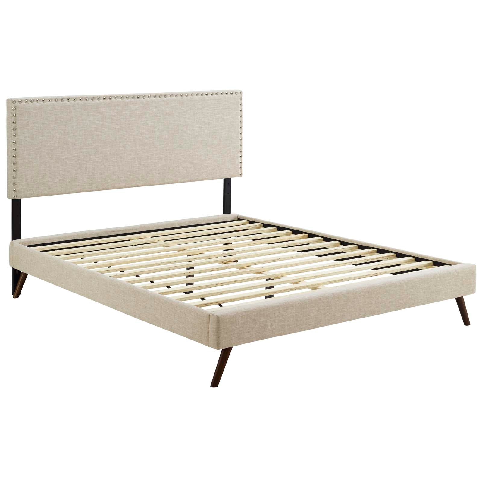 Beige fabric upholstered platform bed with nailhead-trim headboard, slatted base and round splayed legs.