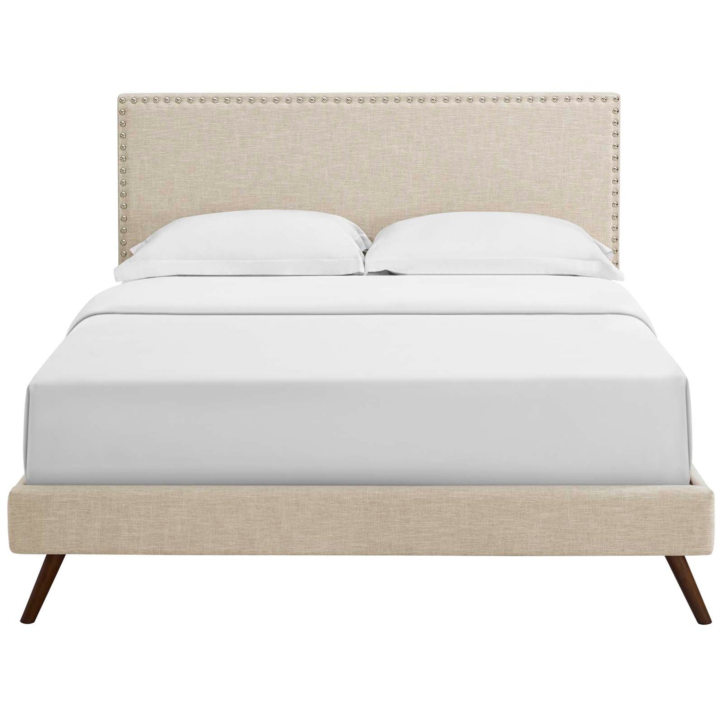 Beige upholstered platform bed with studded nailhead trim headboard, white bedding and round splayed legs.