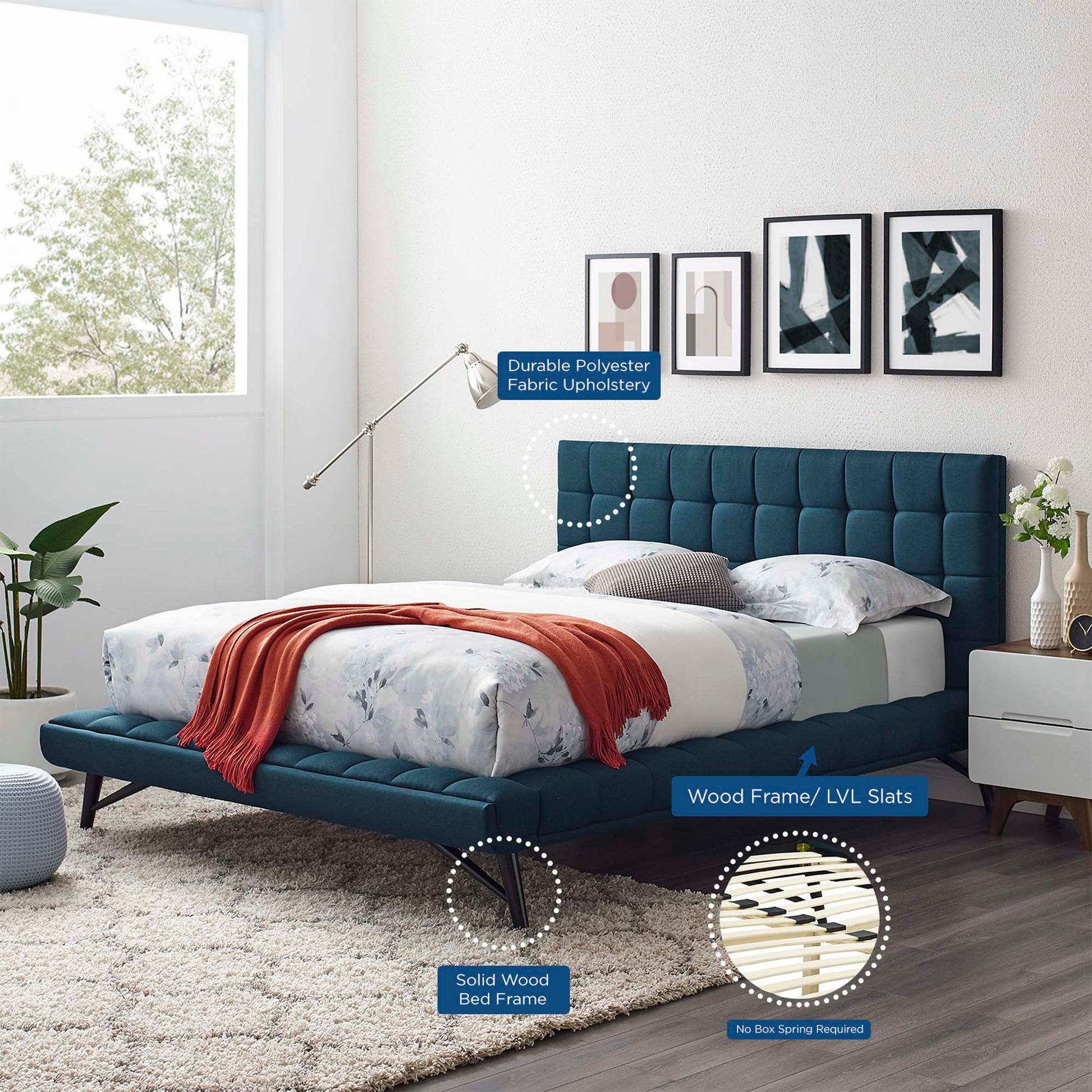 Blue tufted upholstered platform bed with solid wood frame and LVL slats; white floral bedding, orange throw, nightstands