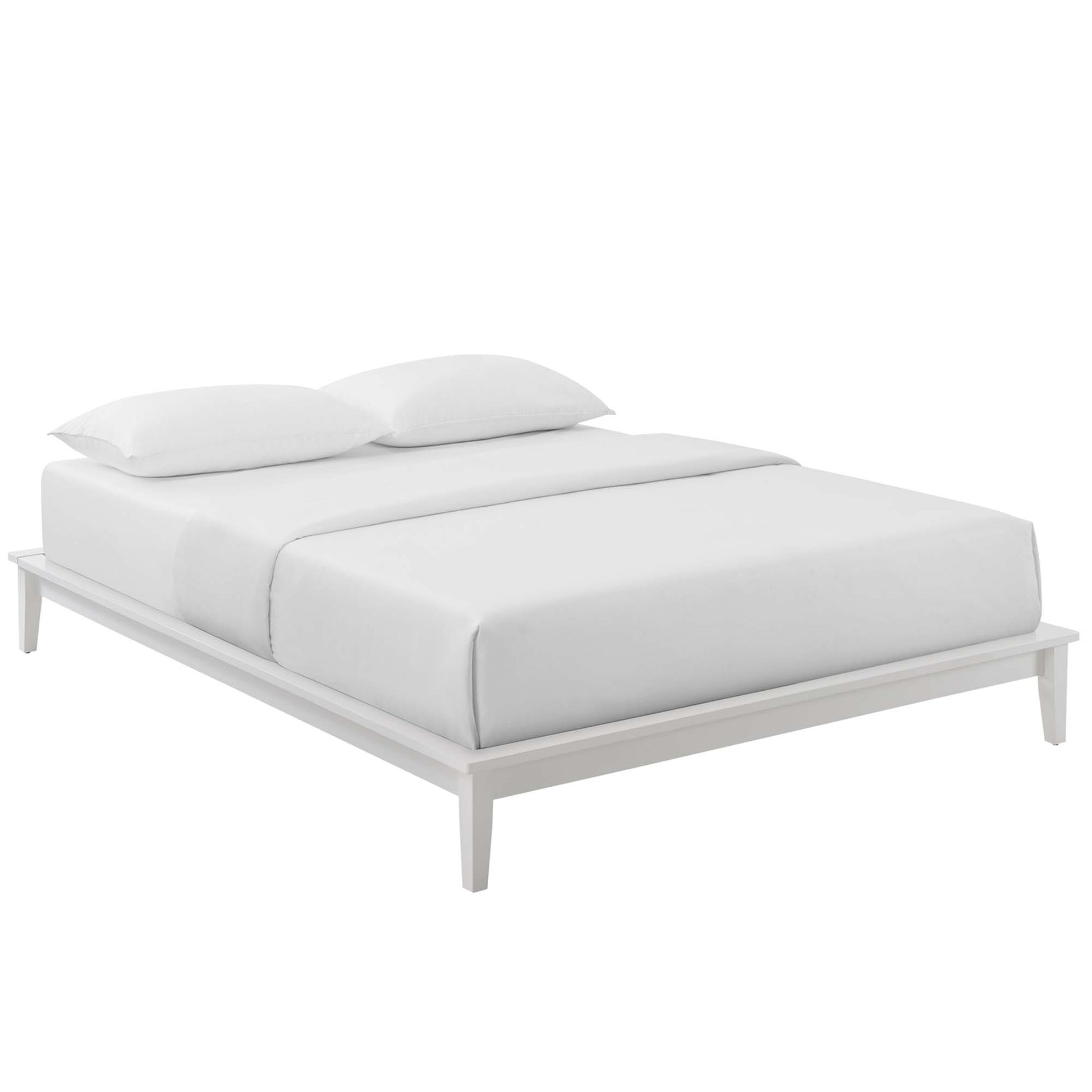White platform bed with a low-profile frame and two white pillows on crisp white bedding.