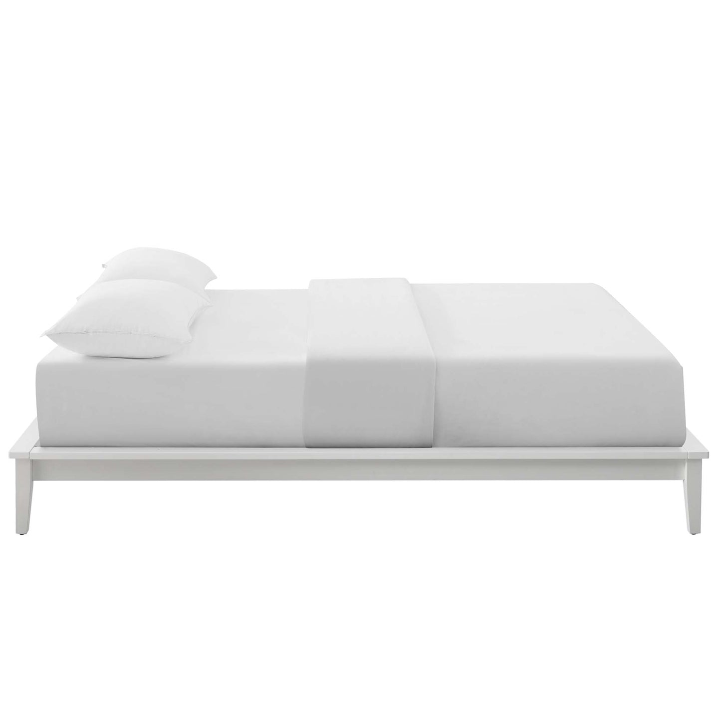 White platform bed with a low, minimalist frame, crisp white bedding and two pillows.