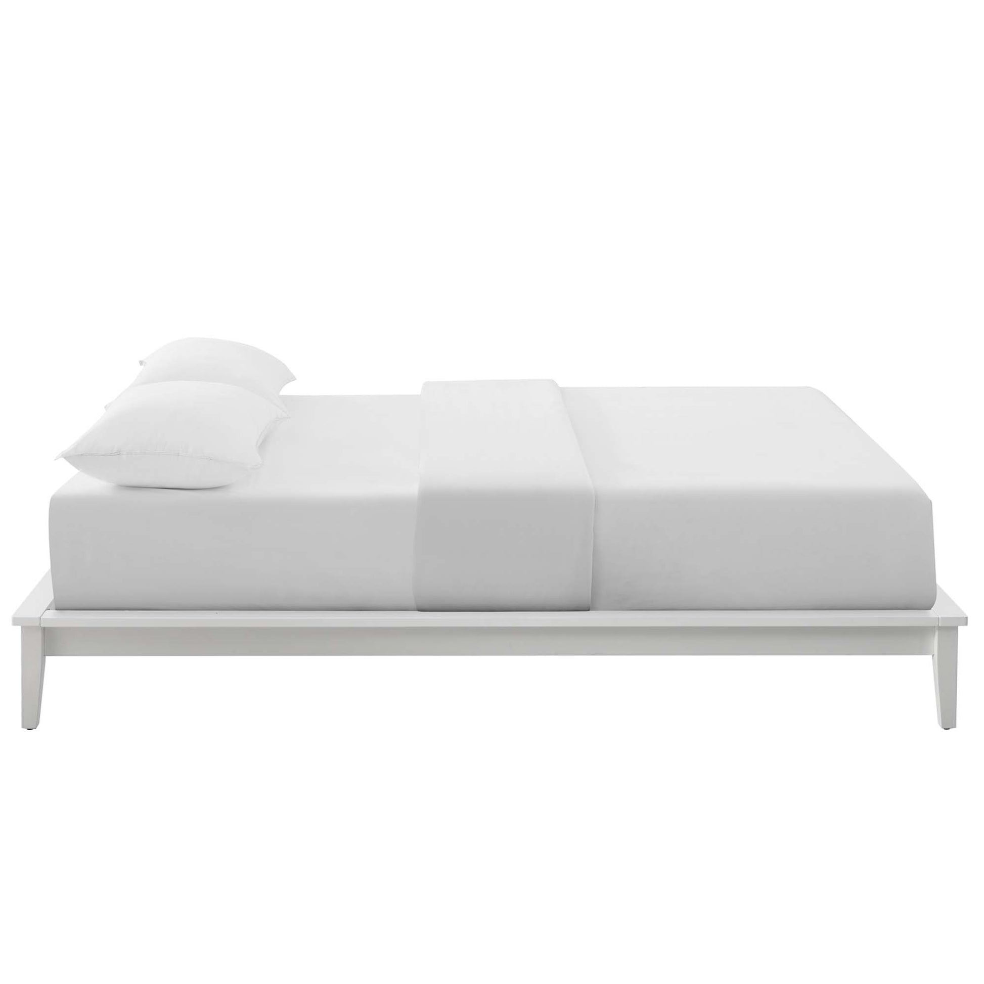White platform bed with a low, minimalist frame, crisp white bedding and two pillows.