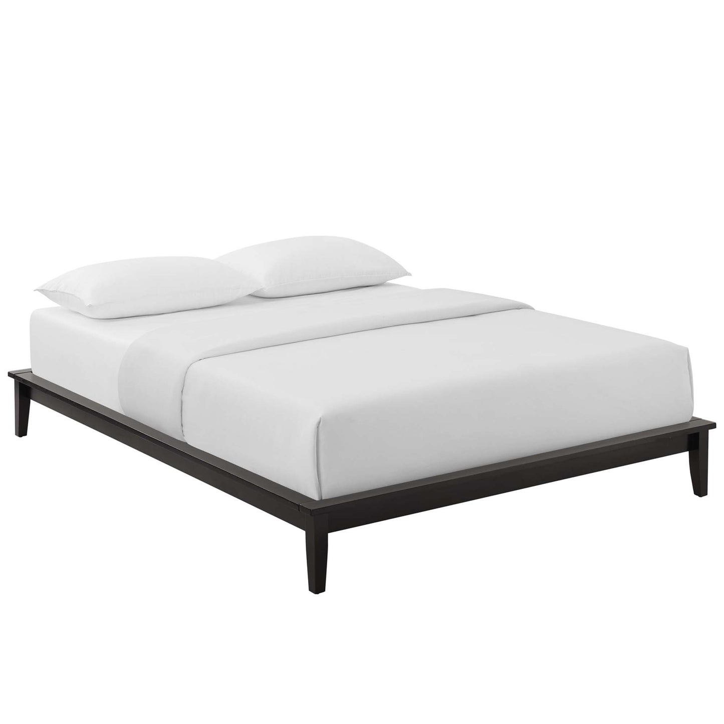 Minimalist dark wood platform bed with a low frame, tapered legs, and white bedding with two pillows.