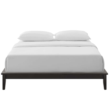 Dark wood platform bed with white bedding and two white pillows, clean minimal modern design.