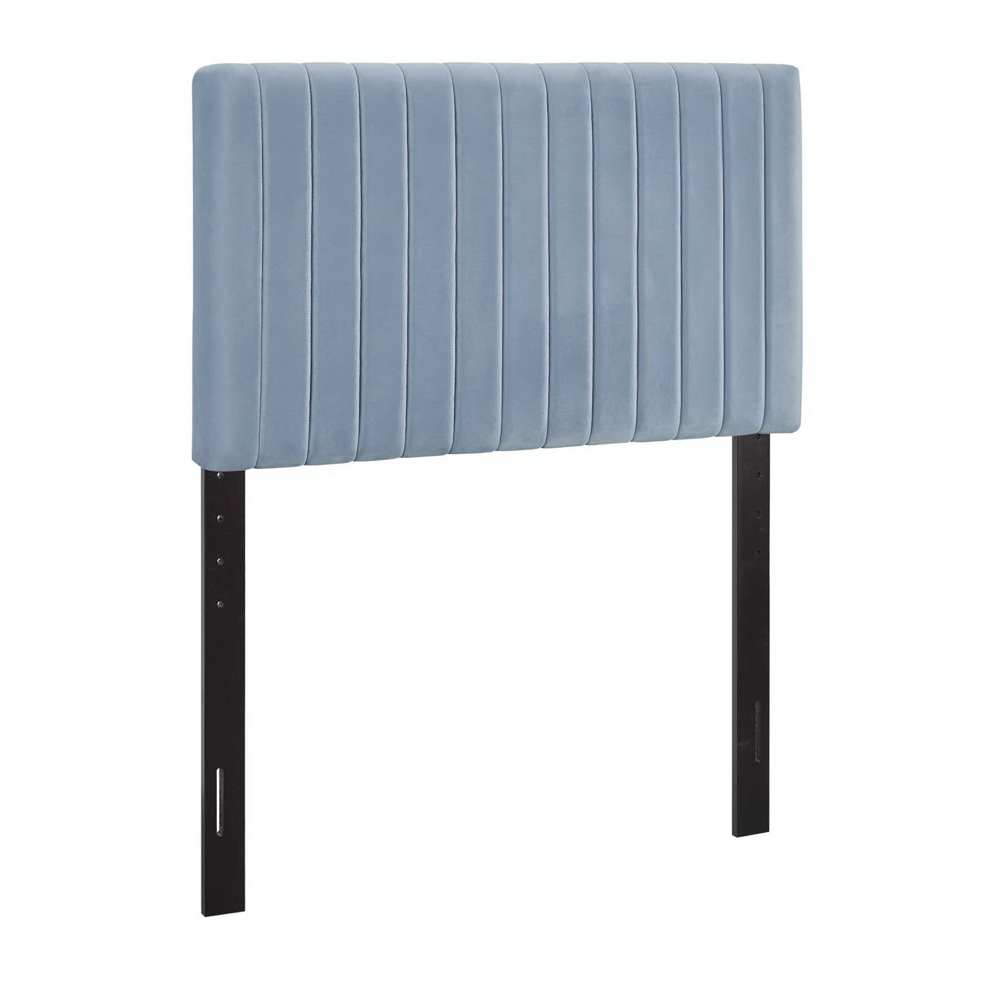 Powder blue upholstered headboard with vertical channel tufting and black metal legs.