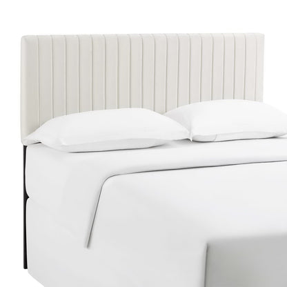 Ivory fabric upholstered headboard with tall vertical-channel panels, white bedding visible, modern minimalist style.