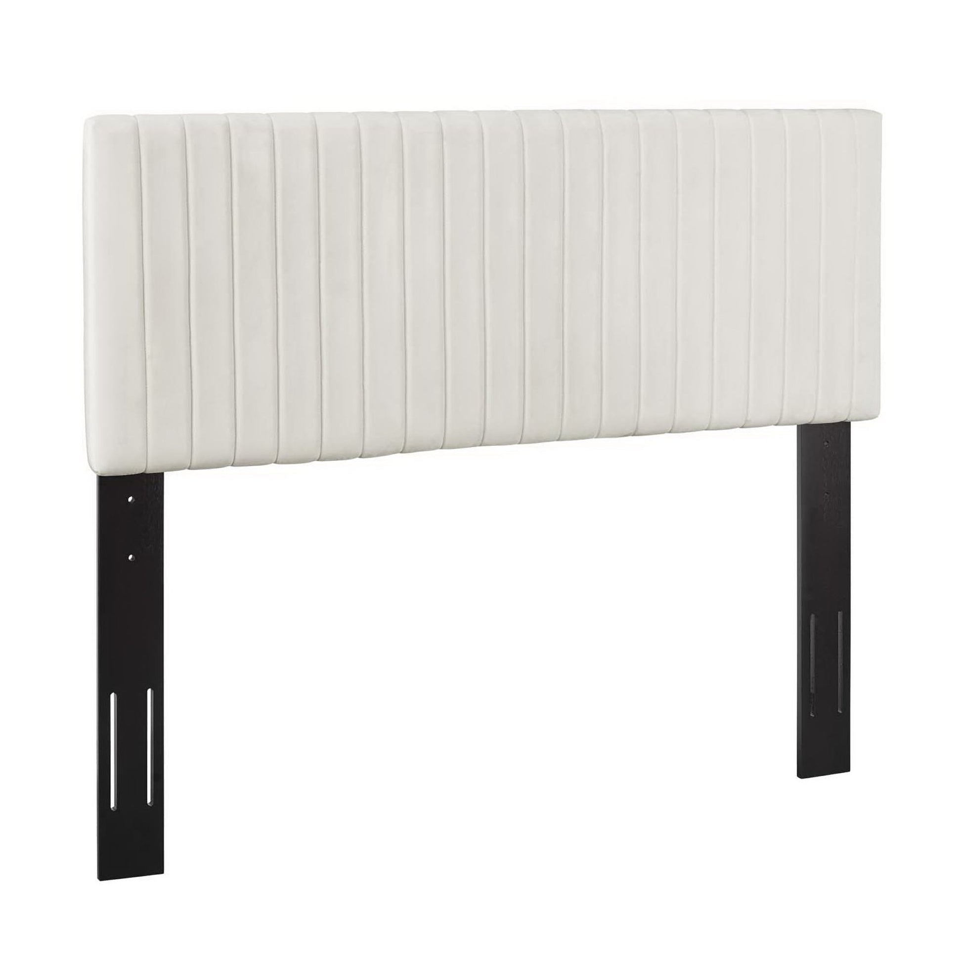 Ivory upholstered headboard with vertical channel tufting on black metal legs.