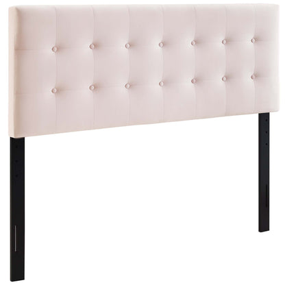 Blush pink tufted upholstered headboard with button details on a rectangular panel and black metal legs.