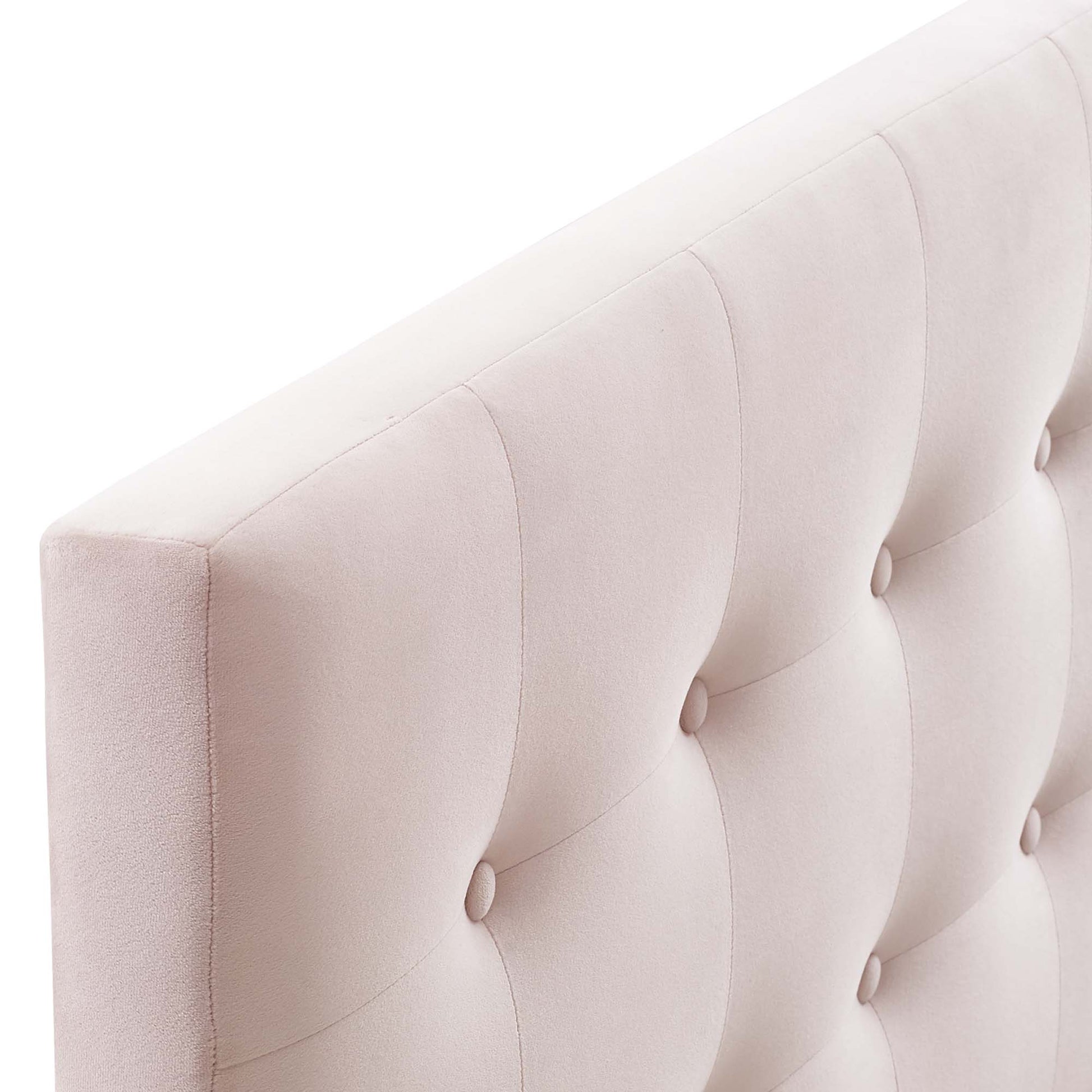 Light pink velvet biscuit-tufted headboard with round button tufts.