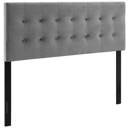 Grey tufted fabric headboard with button-grid pattern and black legs.