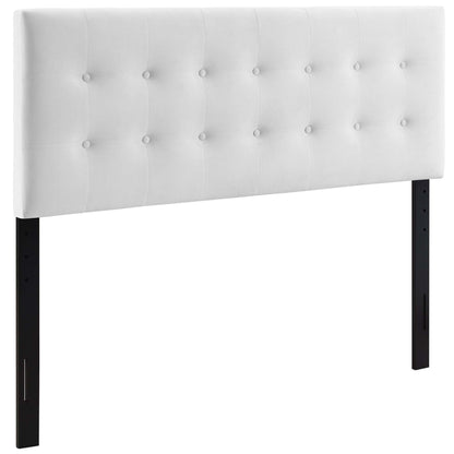 White tufted upholstered headboard with square button studs on black legs, modern bedroom centerpiece.