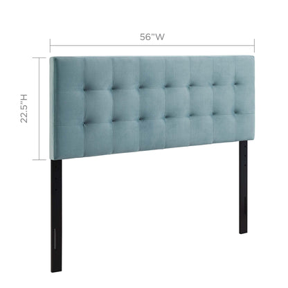 Light blue tufted fabric full headboard, modern upholstered bed centerpiece.