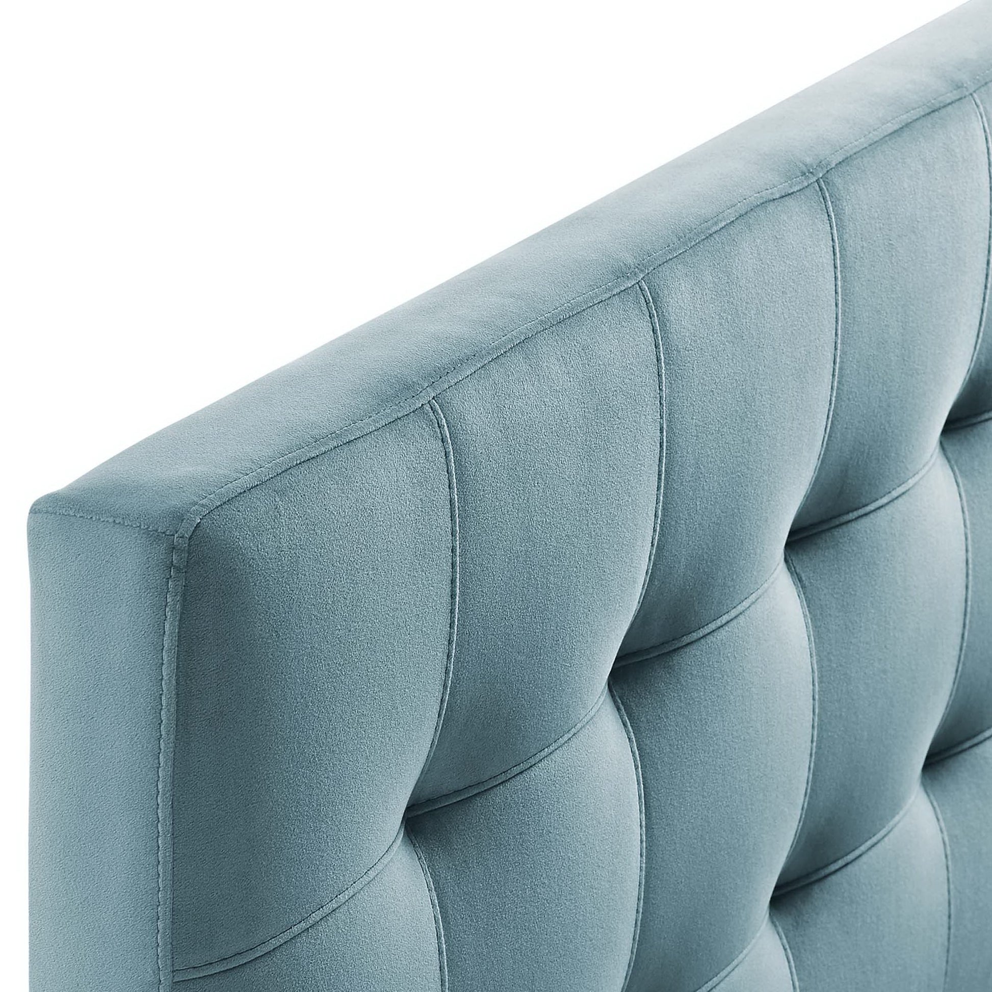 Blue velvet tufted full headboard with vertical channel tufting and curved edge.