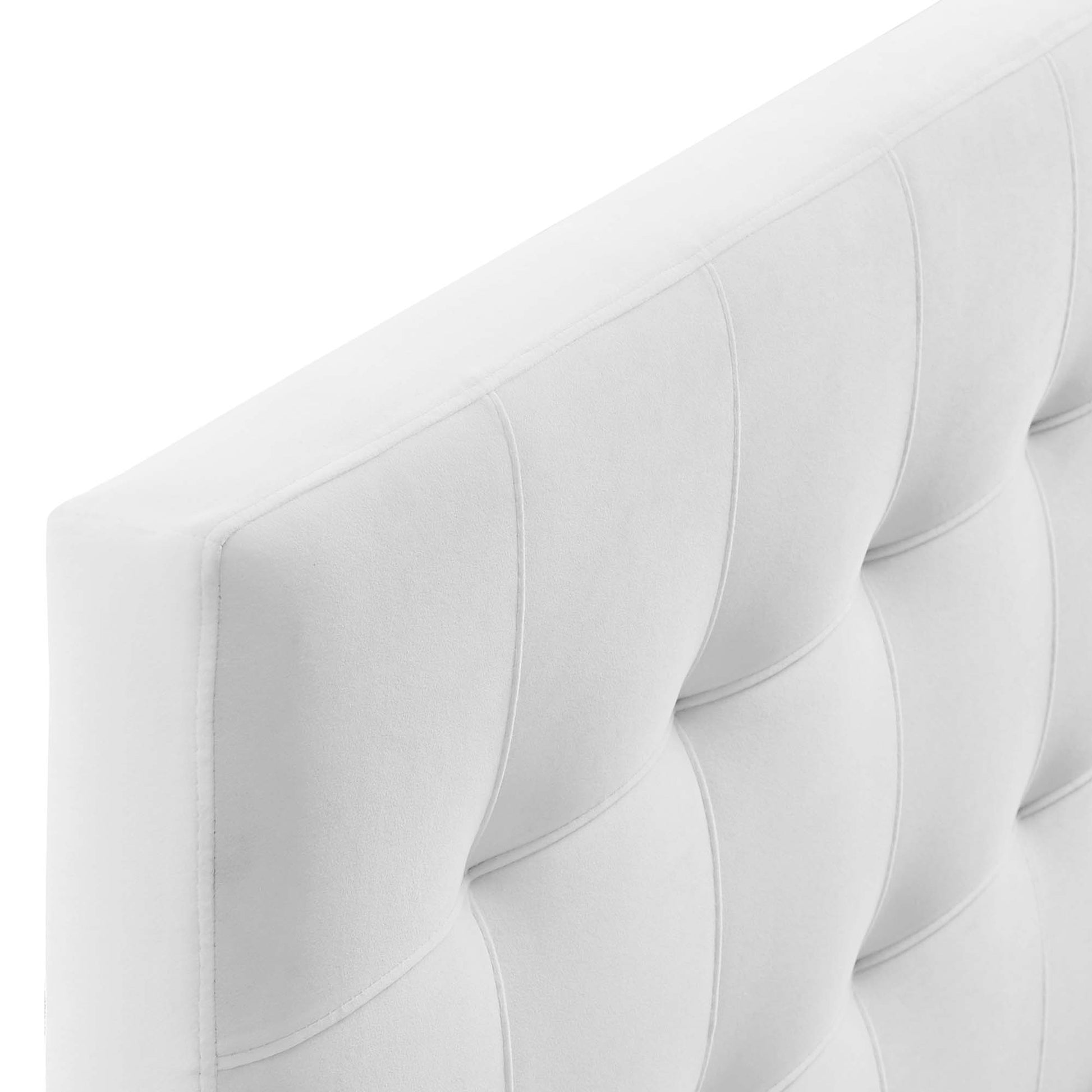 White tufted upholstered panel with vertical channeling and padded square sections; modern headboard.
