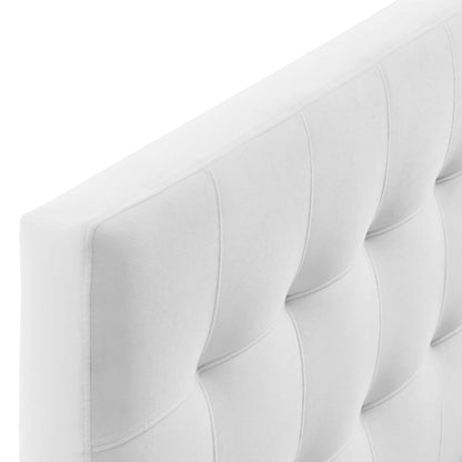 White tufted upholstered panel with vertical channeling and padded square sections; modern headboard.