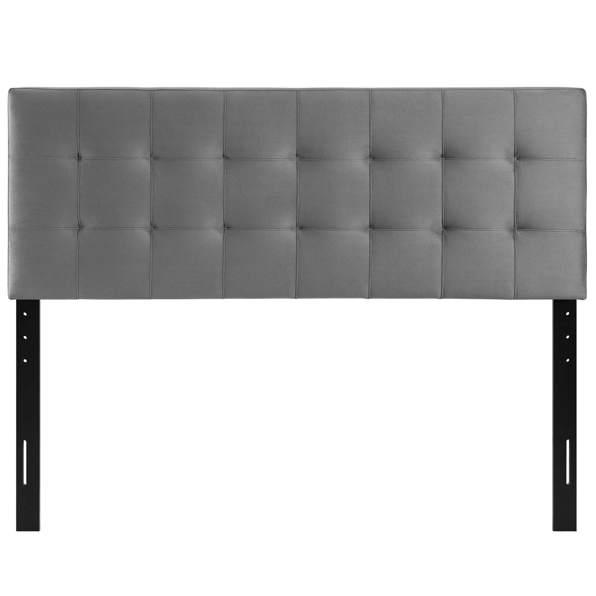 Grey tufted upholstered headboard with square panels and black metal mounting legs.