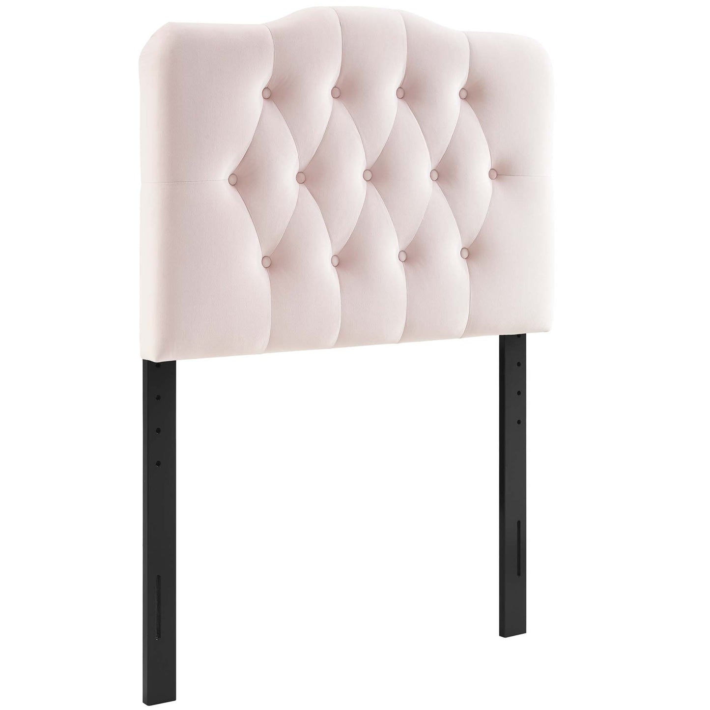 Soft pink tufted headboard with diamond button tufting, curved top, supported by black metal legs.